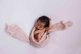 new born wrapped in cloth