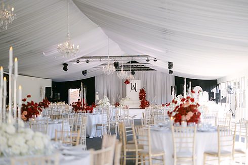 Braxted Park marquee wedding reception with long and round table styling and candlelight