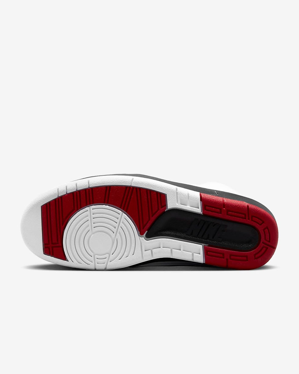Bottom view of a black, white, and red Air Jordan 2 sneakers.