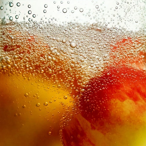 Firefly close up video of bubbles in a cirsp and clear cider. make the image mostly white