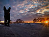dog-standing-field-against-sky-sunset.jpg