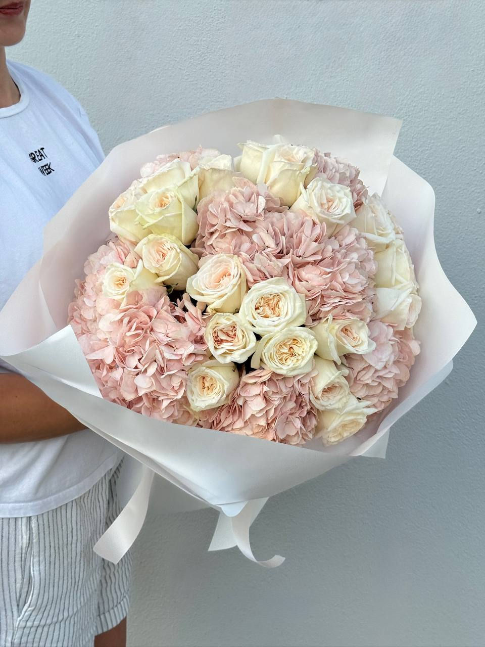 A refined composition of blush hydrangeas and creamy white roses — soft, romantic, and undeniably elegant.