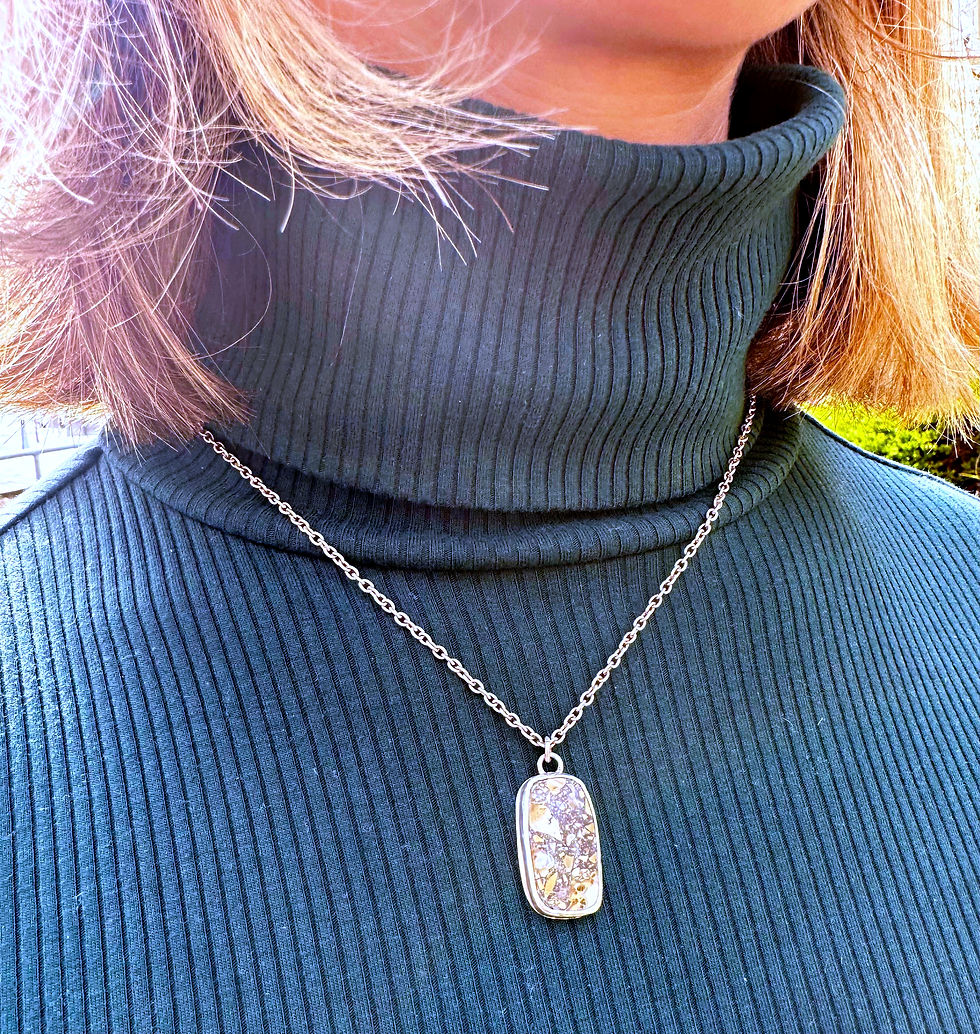 Thumbnail: Mailgano jasper pendant on sterling silver necklace worn by a woman in a green turtleneck