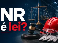 Na imagem é possível ver a frase "NR é lei?", além de itens como um capacete de segurança e símbolos representando a justiça, como uma banlança.