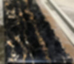 Cheminée en marbre Noir portor gold