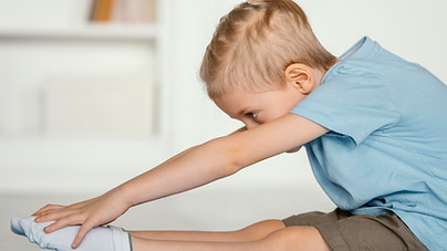 full-shot-boy-stretching-yoga-mat.jpg