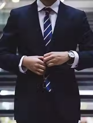 Man Adjusting Suit.avif