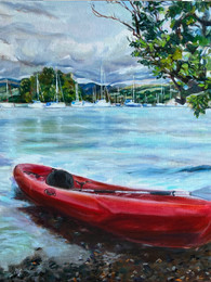 A red kayaking boat in Windermere Lake District