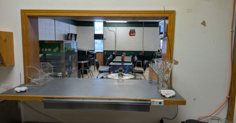 Service counter looking into a restaurant dining area