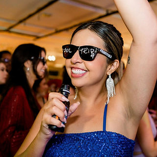 A guest has fun at corporate event with singing waiters