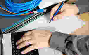 Man Drawing Home Network With Network Switch
