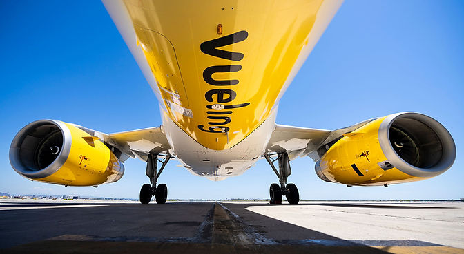 Commercial aviation photography of a Vueling Airbus A320 featuring the Andalucia special livery