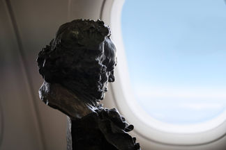Commercial aviation photography featuring a Goya Award beside the window of a Vueling Airbus A320