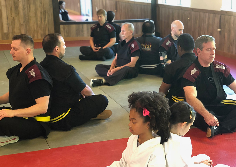 Toshindo martial arts students practicing positive visualization at the Quest Self Defense school in Tampa, FL.
