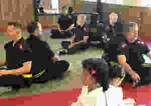 Toshindo martial arts students practicing positive visualization at the Quest Self Defense school in Tampa, FL.
