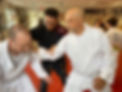 Josh Kraft helping students with their technique of self-defense in T-Shin Do.