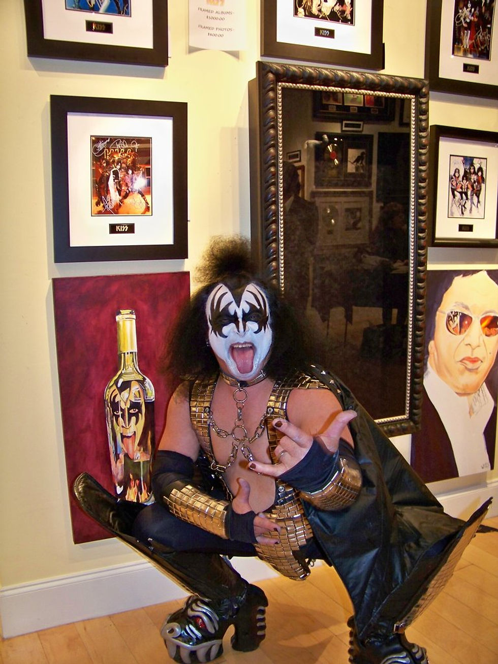 Stacey Wells art on either side of KISS axe bass