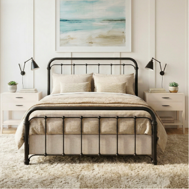 Handcrafted Wesley Allen iron bed in a bright bedroom