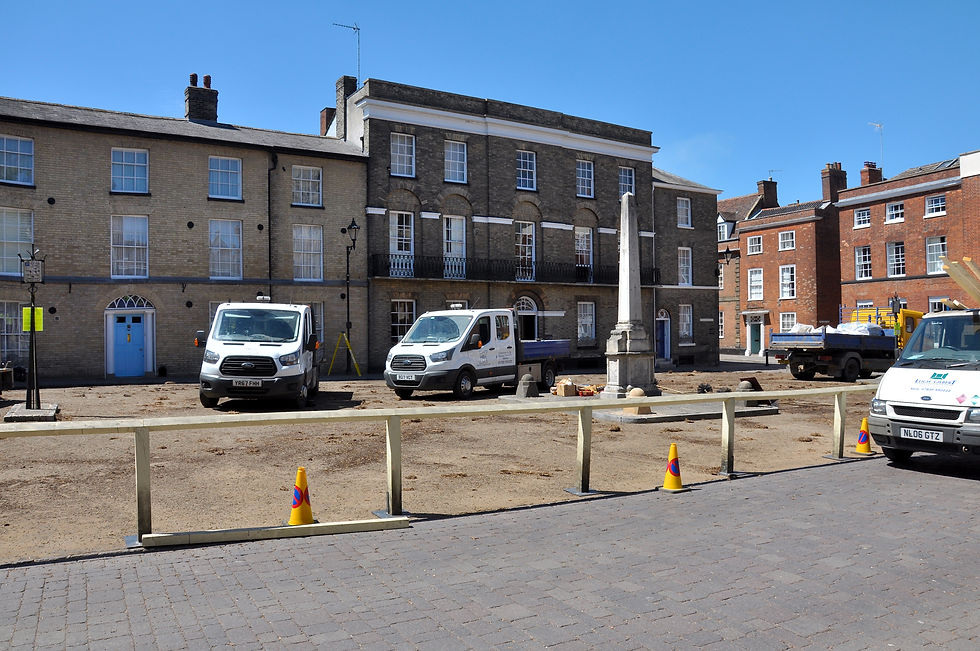 Production vehicles and period street preparation on Angel Hill, Bury St Edmunds, during filming of The Personal History of David Copperfield.