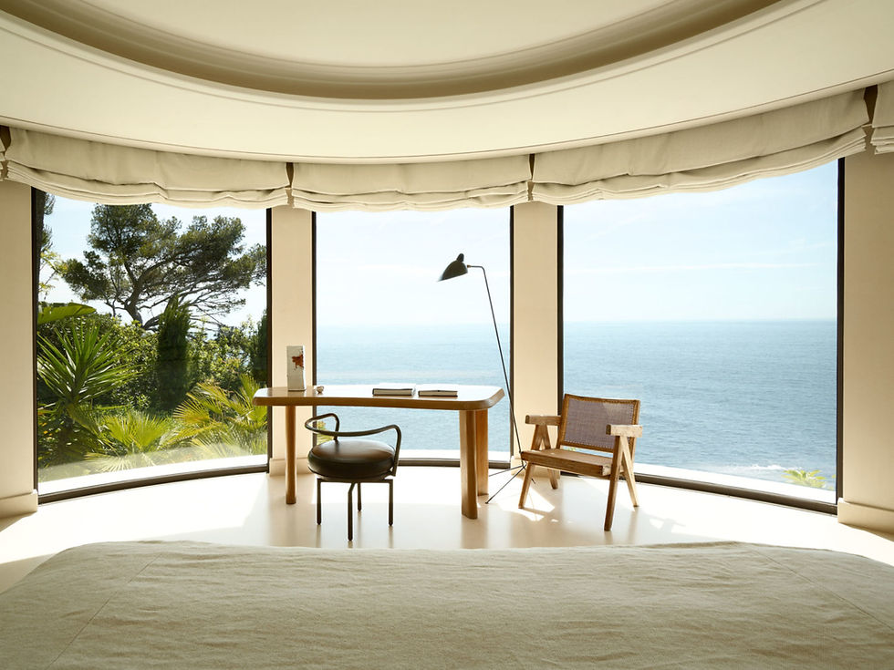 A French Riviera villa bedroom with panoramic sea views