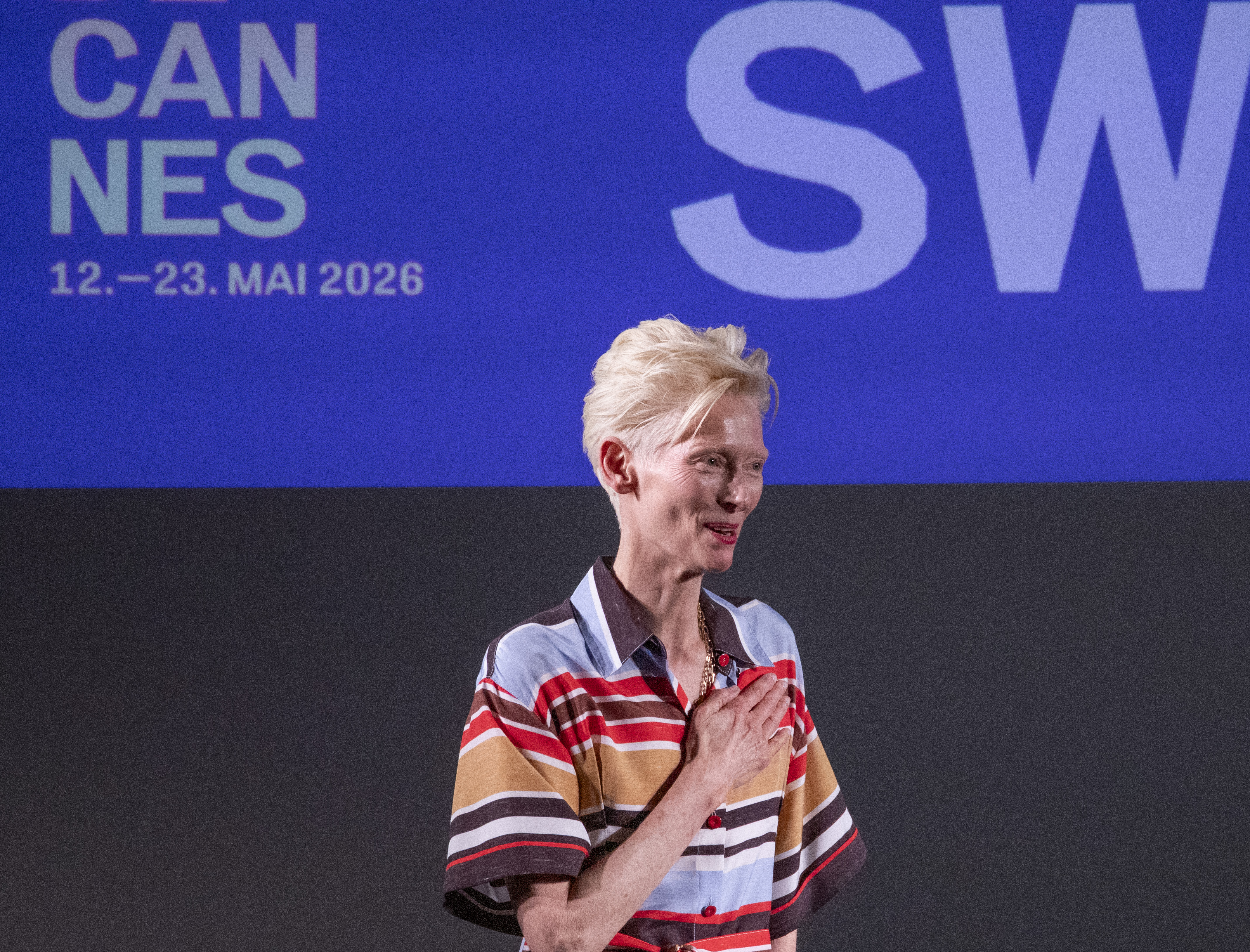 Tilda Swinton speaking at a Cannes Film Festival panel in May 2026