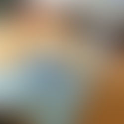 A blonde dog laying down with a cone around their neck