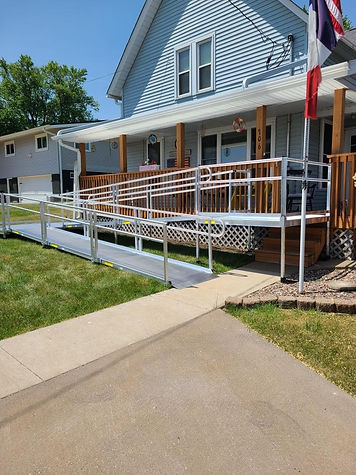 Image of a home with a ramp in front of it.