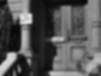 "No Vacancy" signs on ornate double doors of a building with columns, shadows cast on steps. Black and white image, somber mood. The setting is the US World War II housing crisis in the classic Hollywood romantic comedy film rom-com movie 1940s "The More the Merrier".
