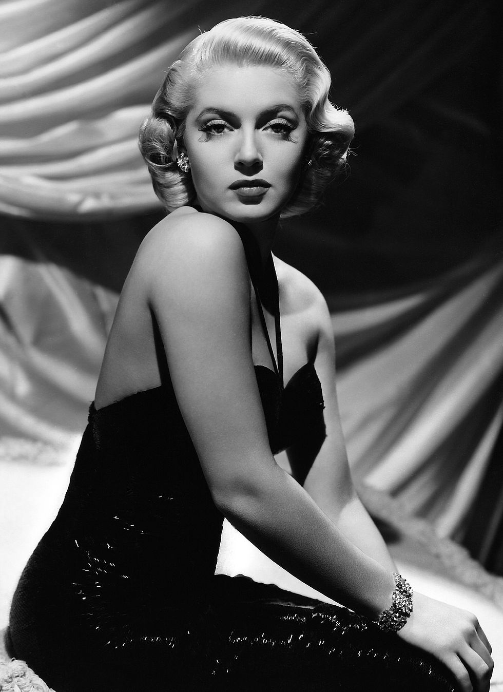 Hollywood actress, movie star, glamor icon, legend, sex symbol Lana Turner portrait in black dress