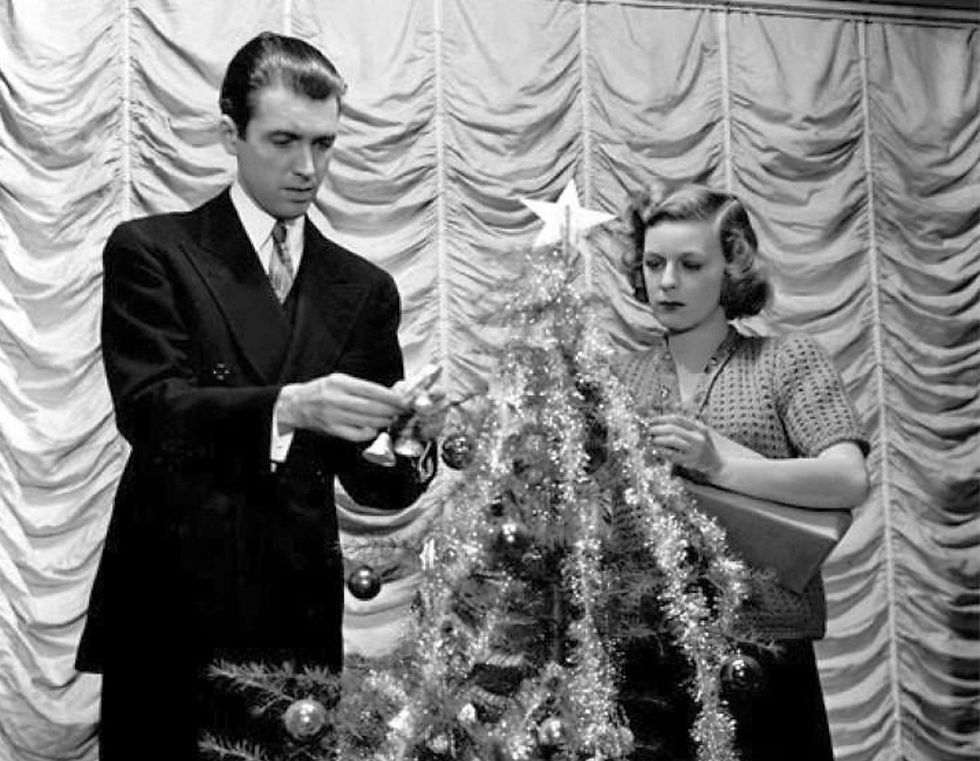 James Stewart and Margaret Sullavan decorate a Christmas Tree in the classic Lubitsch movie Hollywood romantic comedy film "The Shop Around the Corner"