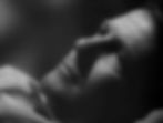 Close-up of a person lying down, gazing upwards with a contemplative expression. Black and white image, dark background, soft lighting. Joel McCrea is tenderly romantic in the classic Hollywood romantic comedy film rom-com movie 1940s "The More the Merrier".