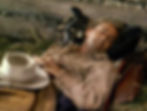Alan Ladd in buckskin suit sleeping in the classic Hollywood George Stevens film Western movie "Shane"