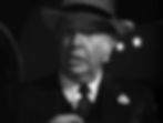 Elderly man in a suit and hat looks surprised in dim light, with bokeh lights in the background. Black and white image. Charles Coburn won an Oscar Academy Award for his starring role in the classic Hollywood romantic comedy film rom-com movie 1940s "The More the Merrier".
