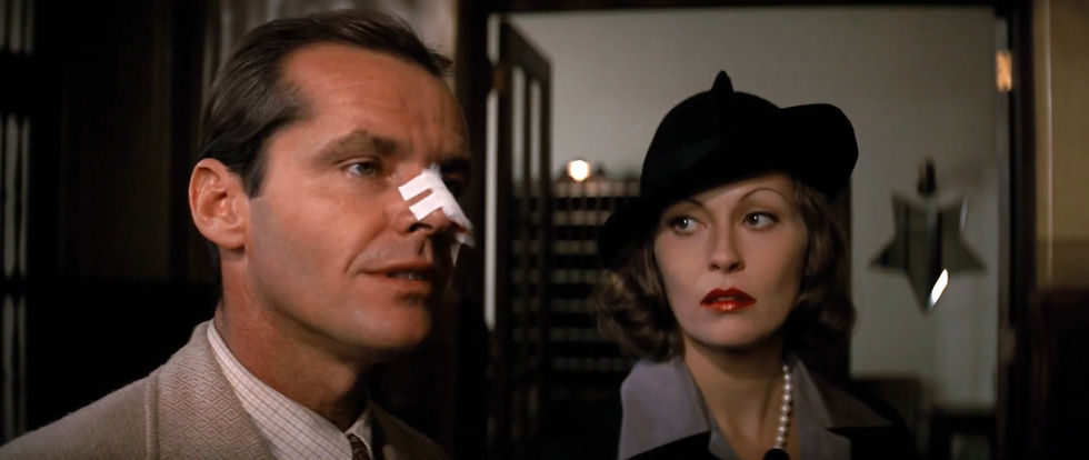 Man and woman indoors. Man with nose bandage, wearing a suit. Woman in black hat, red lipstick, pearl necklace. Moody, dim setting. Jack Nicholson and Faye Dunaway in the classic 1970s Hollywood movie neo-film noir detective thriller story "Chinatown"
