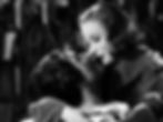 Greta Garbo embraces John Gilbert in the classic Hollywood movie historical costume drama film "Queen Christina"