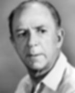 Elderly man in a white shirt, gazing seriously at the camera. Neutral gray background, close-up portrait with a pensive mood. Hollywood movie star film actor portrait photo of younger Jack Albertson
