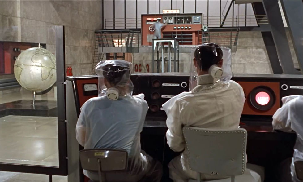Scientists in a futuristic control room watch an operator on a platform; a globe stands left and an ACTIVE light glows red. The evil Dr. No Joseph Wiseman in the nuclear laboratory in the first classic James Bond movie espionage spy thriller 007 film 1962 "Dr. No"
