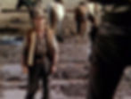 Elisha Cook Jr looks at Jack Planaces's gun in the classic Hollywood George Stevens film Western movie "Shane"
