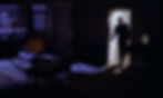 Silhouetted man in a dark room steps through a bright doorway, with blue-lit blinds and a lamp casting a moody noir feel. Sean Connery enters the room in the first classic James Bond movie espionage spy thriller 007 film 1962 "Dr. No"