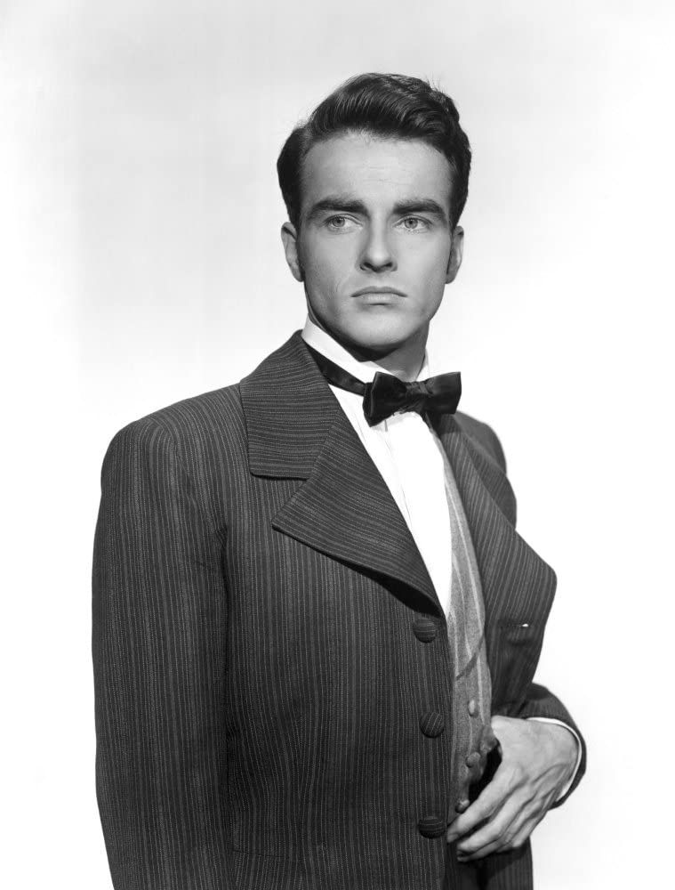 portrait photo of young Hollywood movie star film method actor Montgomery Clift in suit and bowtie