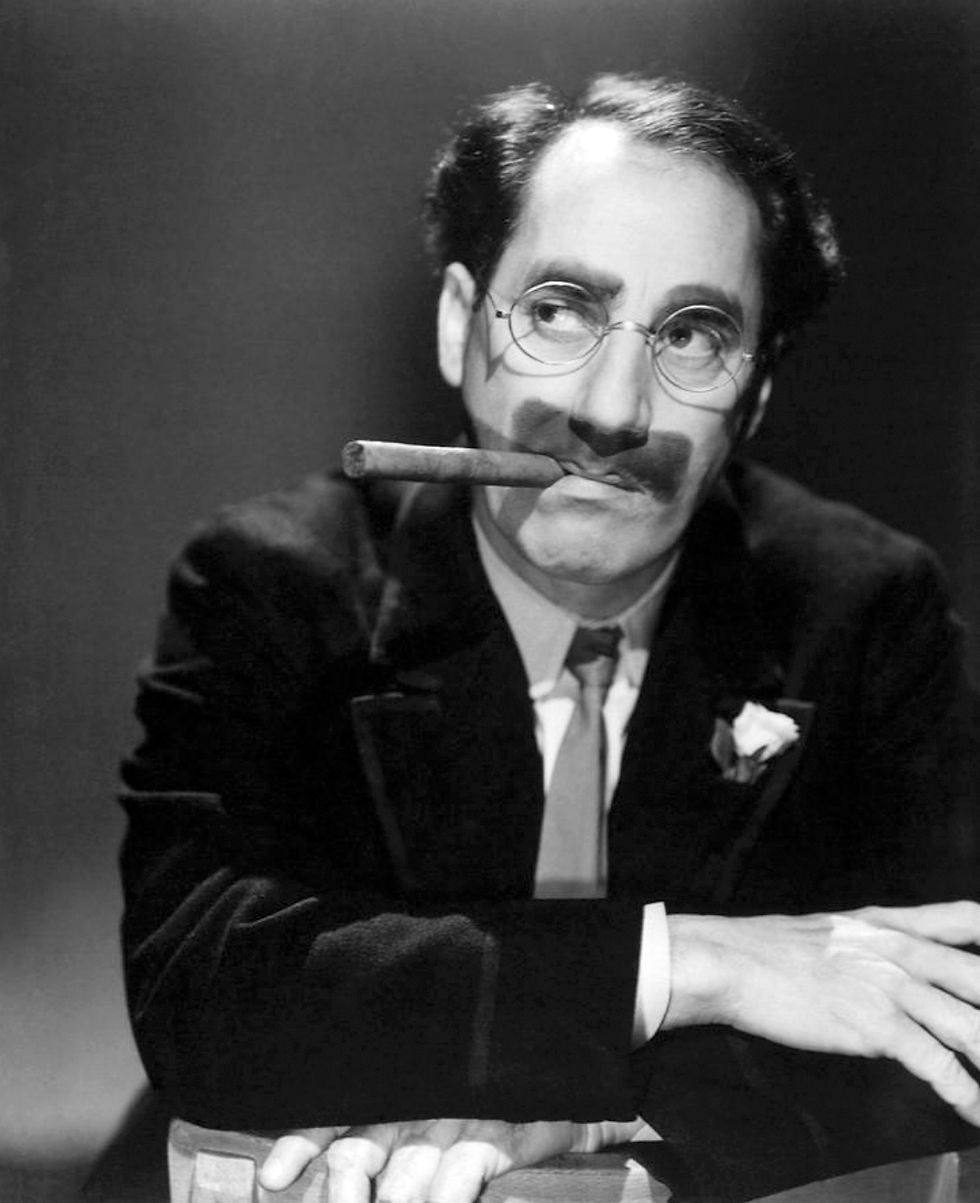 Portrait photo of comedy icon, legend movie star film TV radio actor Groucho Marx with cigar