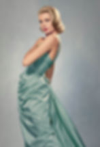 Woman in elegant teal satin dress poses against a neutral backdrop. Hair is styled in loose waves. The mood is poised and sophisticated. Portrait of Hollywood movie star film actress young Grace Kelly Princess Grace of Monaco