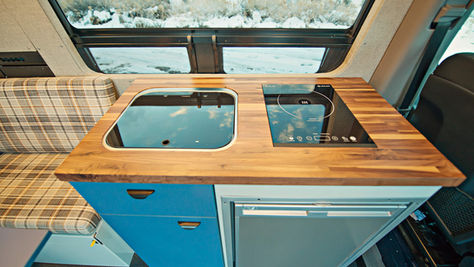 Why We Use Induction Cooktops in Our Van Builds