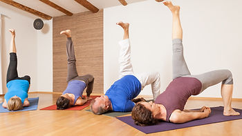 An image of some people doing yoga exercises - Eka Pada Setu Bandha Sarvangasana