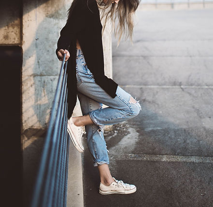a woman in cropped jeans with anxiety