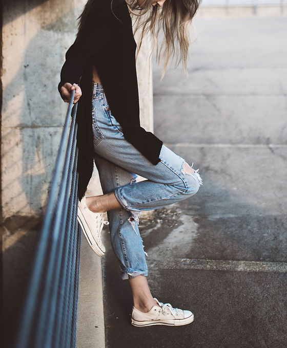 A Woman Wearing Cropped Jeans