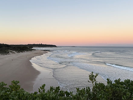 Sunset view of the ocean shore line at Caves Beach from the look out on the headland of Caves beach