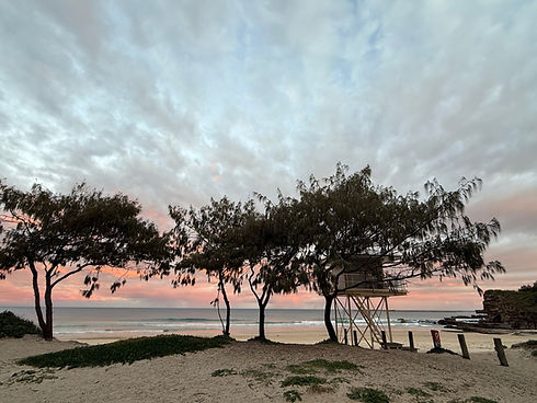 Sunset at Caves beach, lifeguard tower overlooking the family friendly beach
