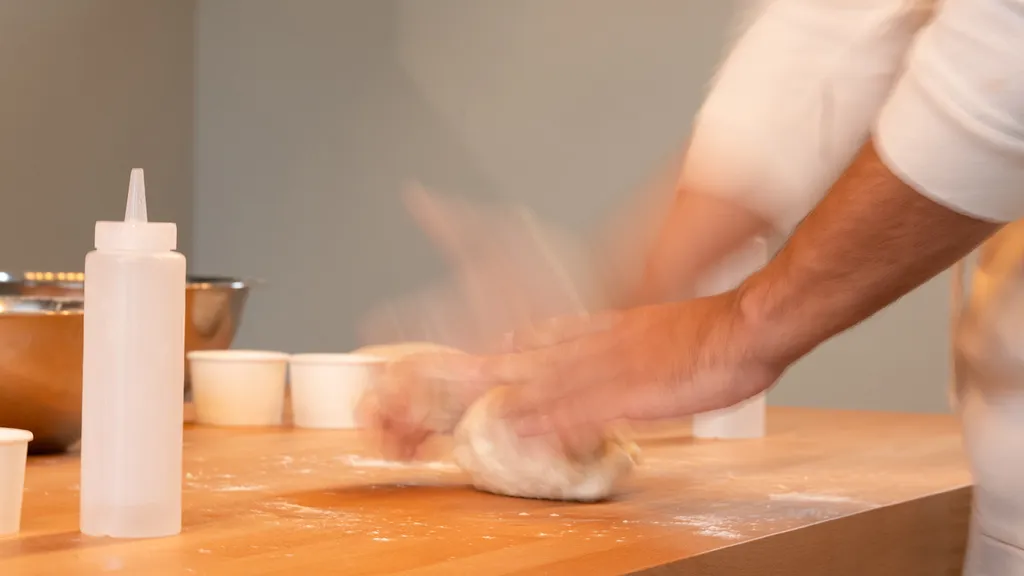 Pizza-making class at ALBA Zurich with happy participants kneading dough — captured for BYCA’s local food guide.