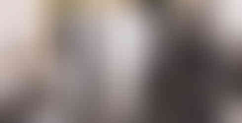 Minimalist interior at Draft Coffee in Zurich featuring sculptural metallic furniture, soft lighting, and a sleek espresso bar – featured in the BYCA Zurich Guide.